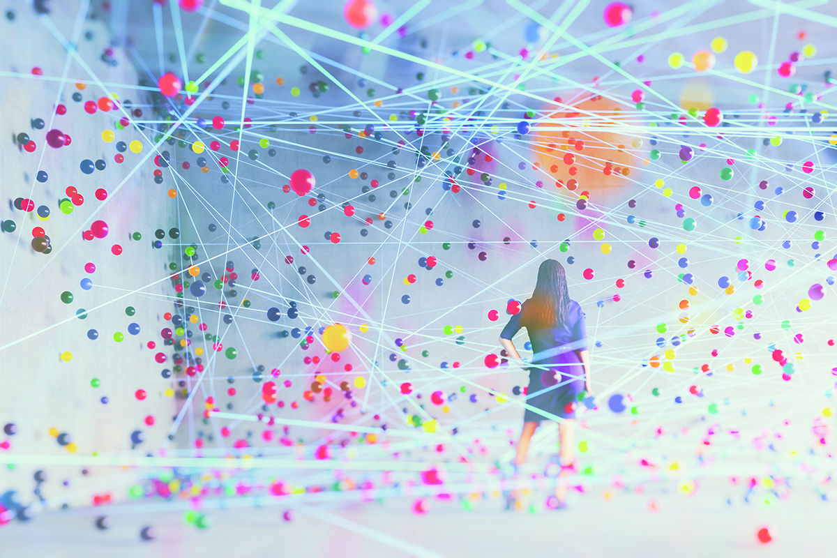 Woman in concrete room with flowing abstract particles